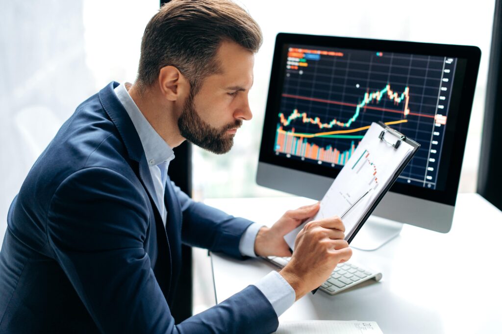Investor reviewing forex performance using a regulated Forex managed account service for safe and transparent trading.