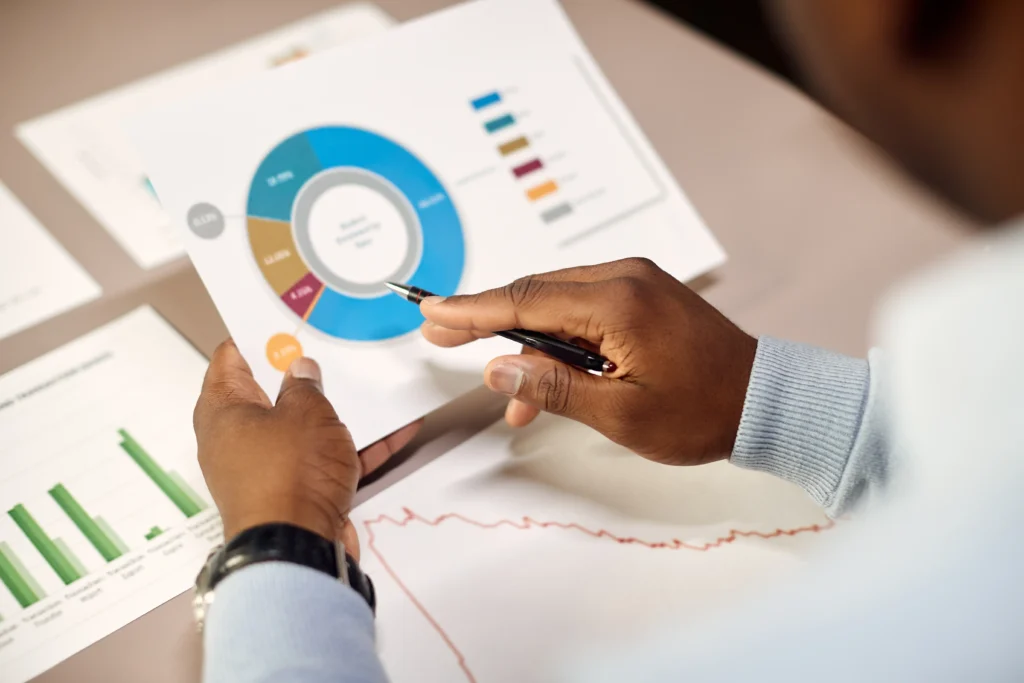 Manager analyzing charts with forex indicators.