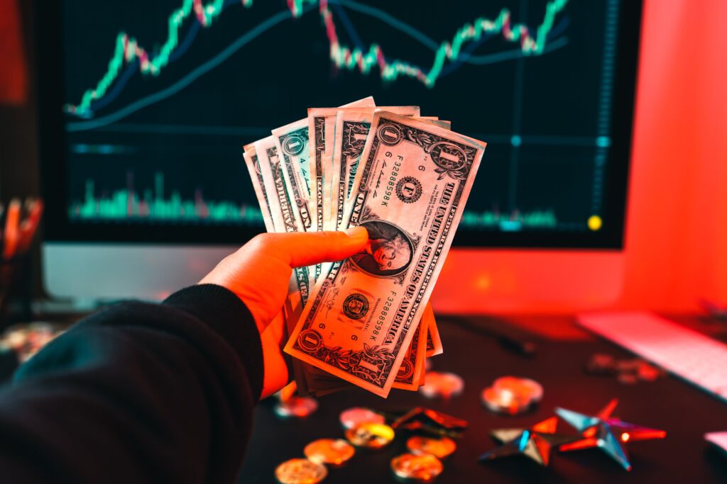 Crypto coins and money on desk showing hedging in forex.