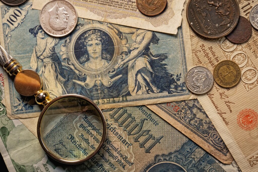 Old notes and coins showing the history of forex trading and global currency exchange.