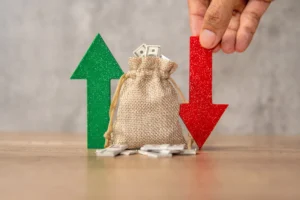 What moves price action concept with burlap money bag and green up arrow and red down arrow.