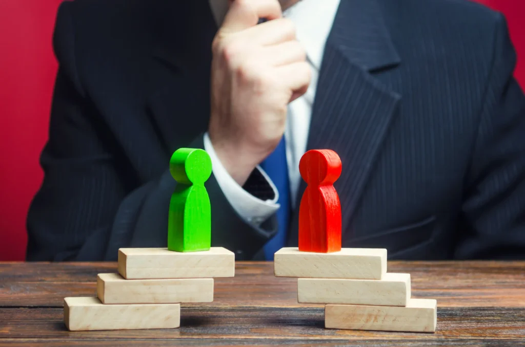 Divergence vs. Convergence concept with two figures on stairs.