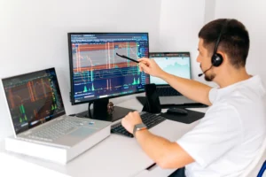 Trader following a Pre-Market Routine while analyzing forex and crypto charts on multiple monitors.