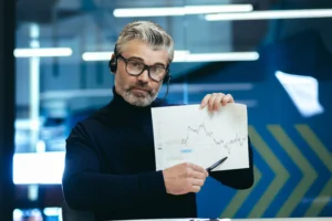 Trader showing Support and Resistance Strategies on a chart during financial analysis