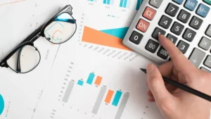 Volume Weighted Average Price calculation with financial charts, graphs, and a calculator on a desk in 2025.