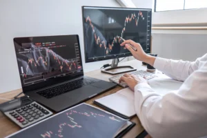 Trader using Reversal Trading System on candlestick charts.