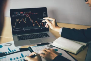 Scalping strategies being discussed by traders analyzing charts and financial reports for profitable short-term market opportunities.