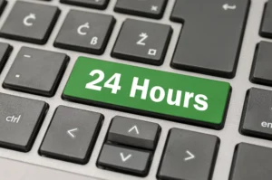Green 24 Hours key on a computer keyboard symbolizing nonstop trading access