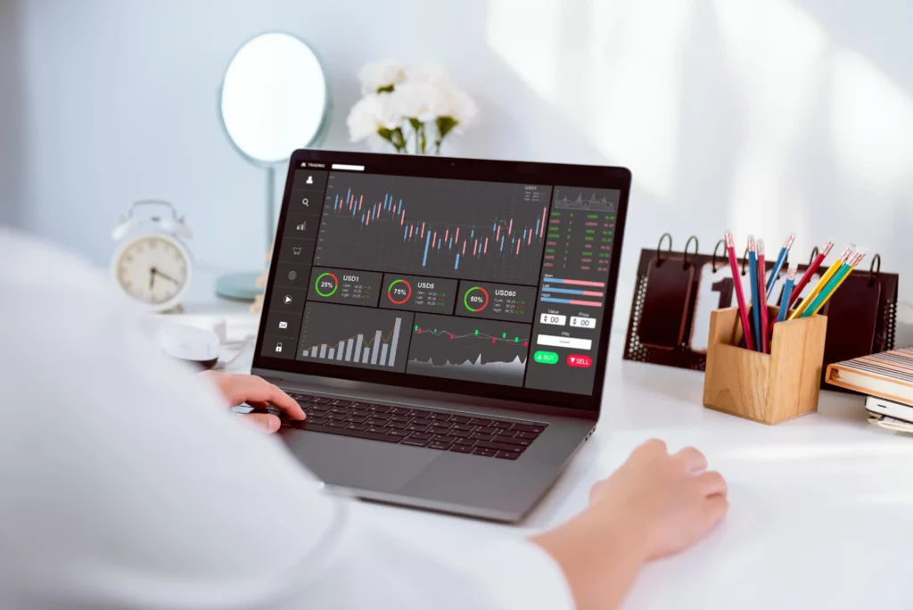 MetaTrader 5 Trading Platform showing forex charts and trading tools on a laptop screen in 2025.