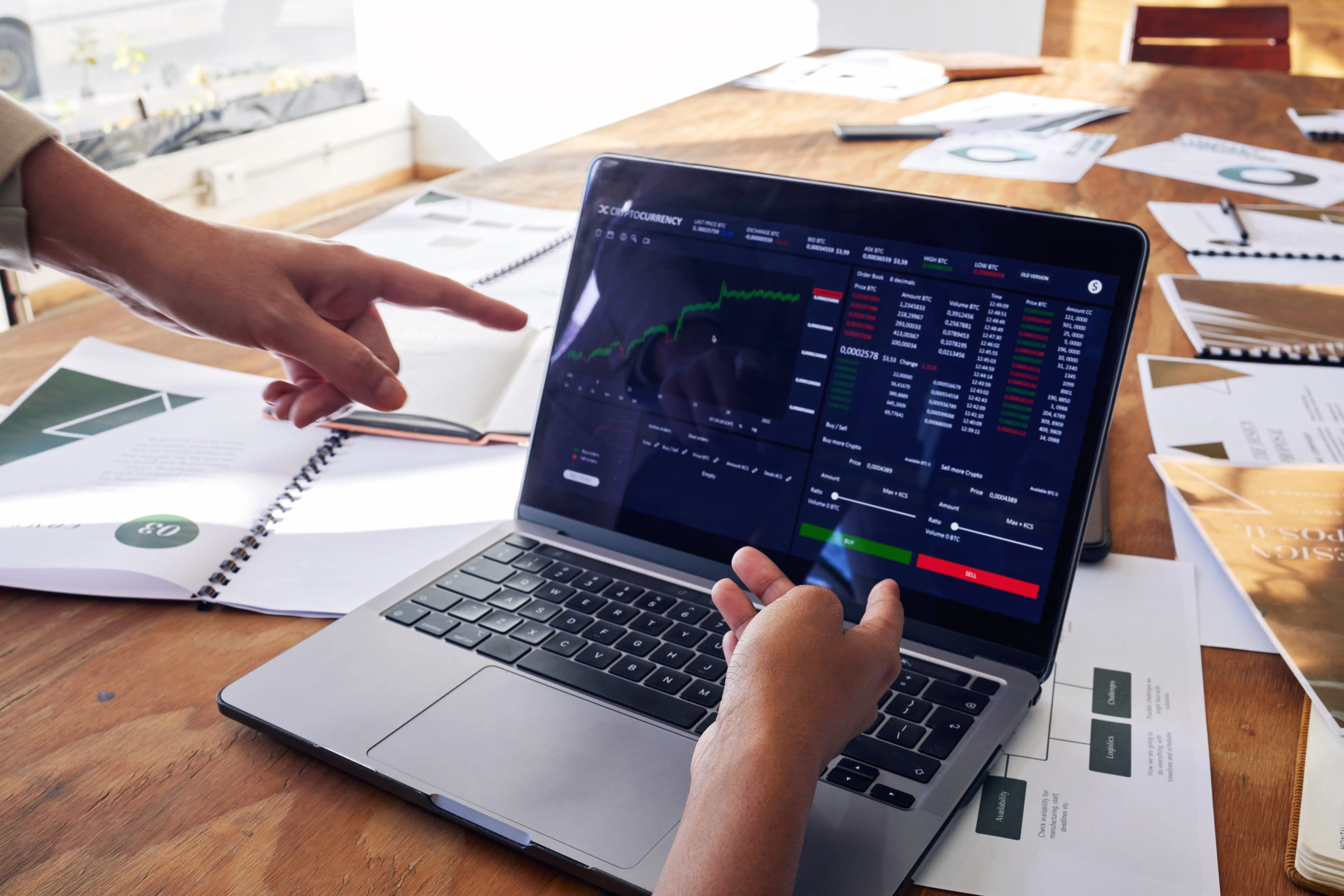 Traders analyzing charts on MT5 for Funded Account Traders platform with real-time market data and risk management tools.