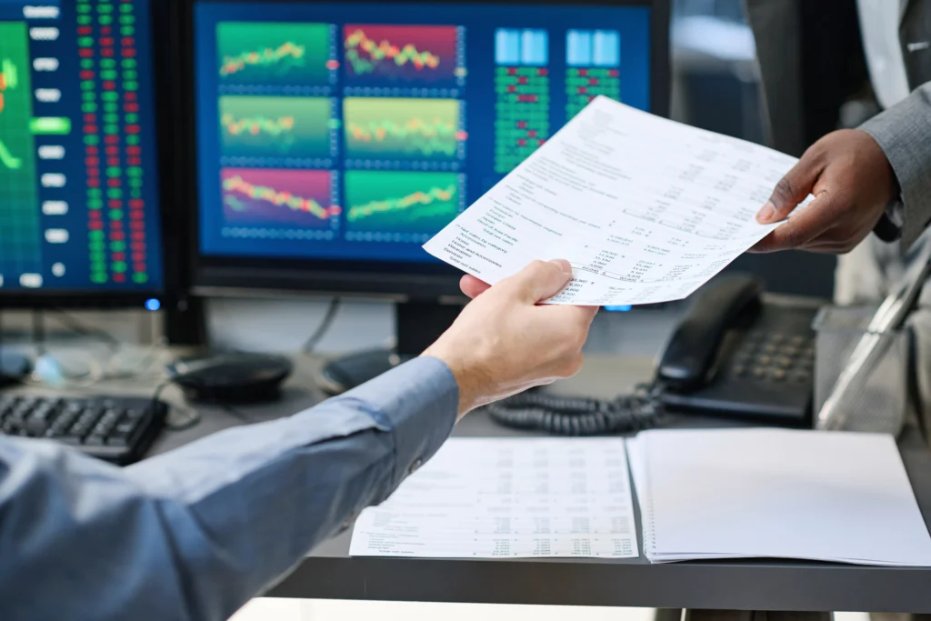 CFD Prop Trading Firms retail traders analyzing charts and reports in 2025