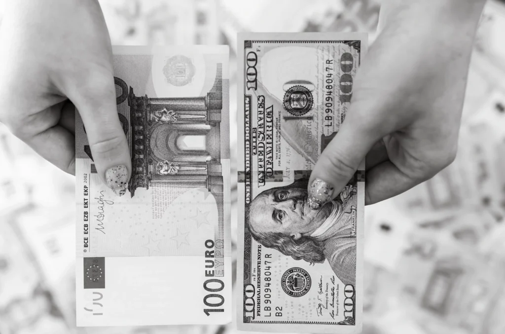 100 Euro and 100 US Dollar bills symbolising global currency crisis examples and currency collapse history in world economies 2025.