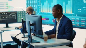 Managed Accounts Forex professionals analyzing market charts and performance data on trading screens