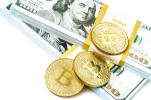 Gold Bitcoin coins placed on bundles of US dollar bills representing the relationship between cryptocurrency and traditional currencies.