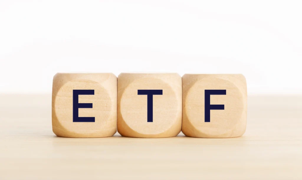 Wooden blocks spelling ETF — representing Exchange Traded Funds for Day Trading in 2025.