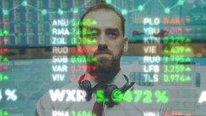 Investor analyzing stock market volatility data as VIX Index 2025 rises, showing market fear and uncertainty trends.
