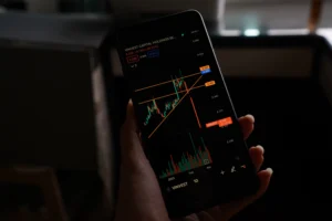 Chart on mobile screen showing an Ascending Triangle Pattern breakout with trendlines and volume analysis.