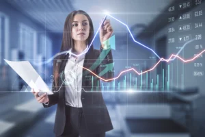A business analyst studying economic indicators and market performance on a digital financial chart in a modern office.
