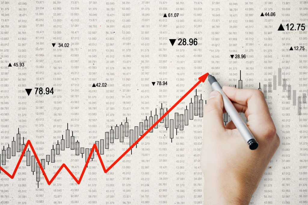 Hand drawing an upward trend line over a candlestick chart, symbolizing strong signals in the Supertrend RSI strategy.