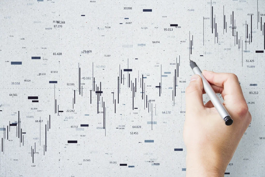 Hand analyzing bearish candlestick chart patterns on a digital trading screen background, representing technical analysis in Forex and stock markets 2025.