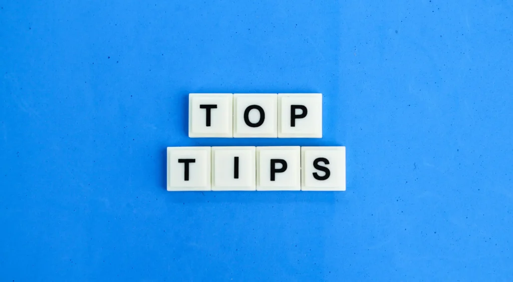 Image showing white letter tiles spelling “Top Tips” on a blue background, used for the article Top 10 Backtesting Tips.