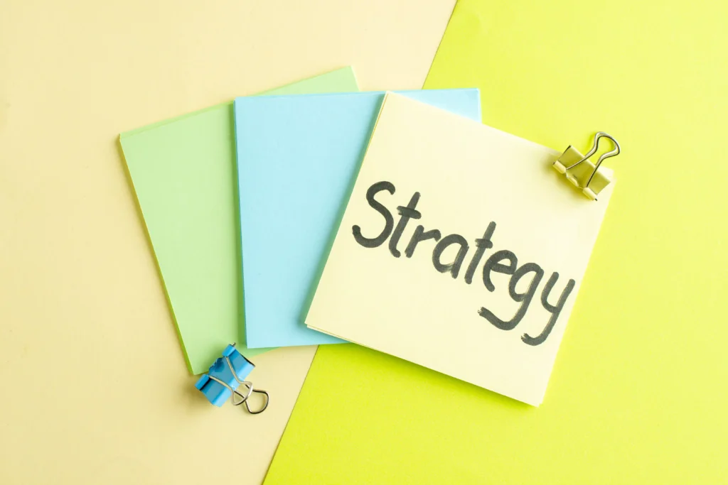 Colorful note cards with the word “Strategy” written on top, representing planning and decision-making in Hedging Strategies for 2025.