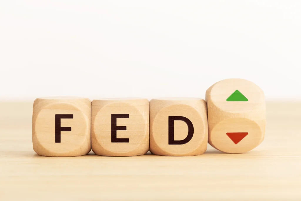 Fed’s Third Rate Cut Crypto Impact showing rate direction symbols