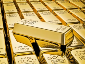 Gold Outperformed in 2025 shown by stacked 999.9 fine gold bars symbolising strong safe haven demand.
