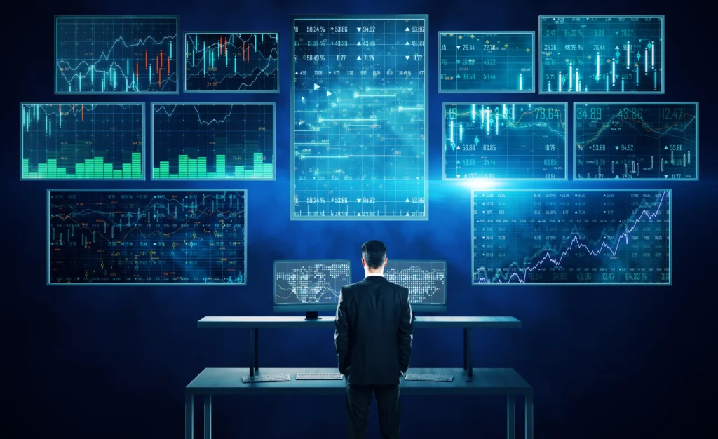 Is Trading Worth It in 2026 — a trader analyzes multiple digital screens showing forex, stock, and market data to assess global trading opportunities.