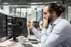 Trader analyzing forex charts and facing harsh trading realities.